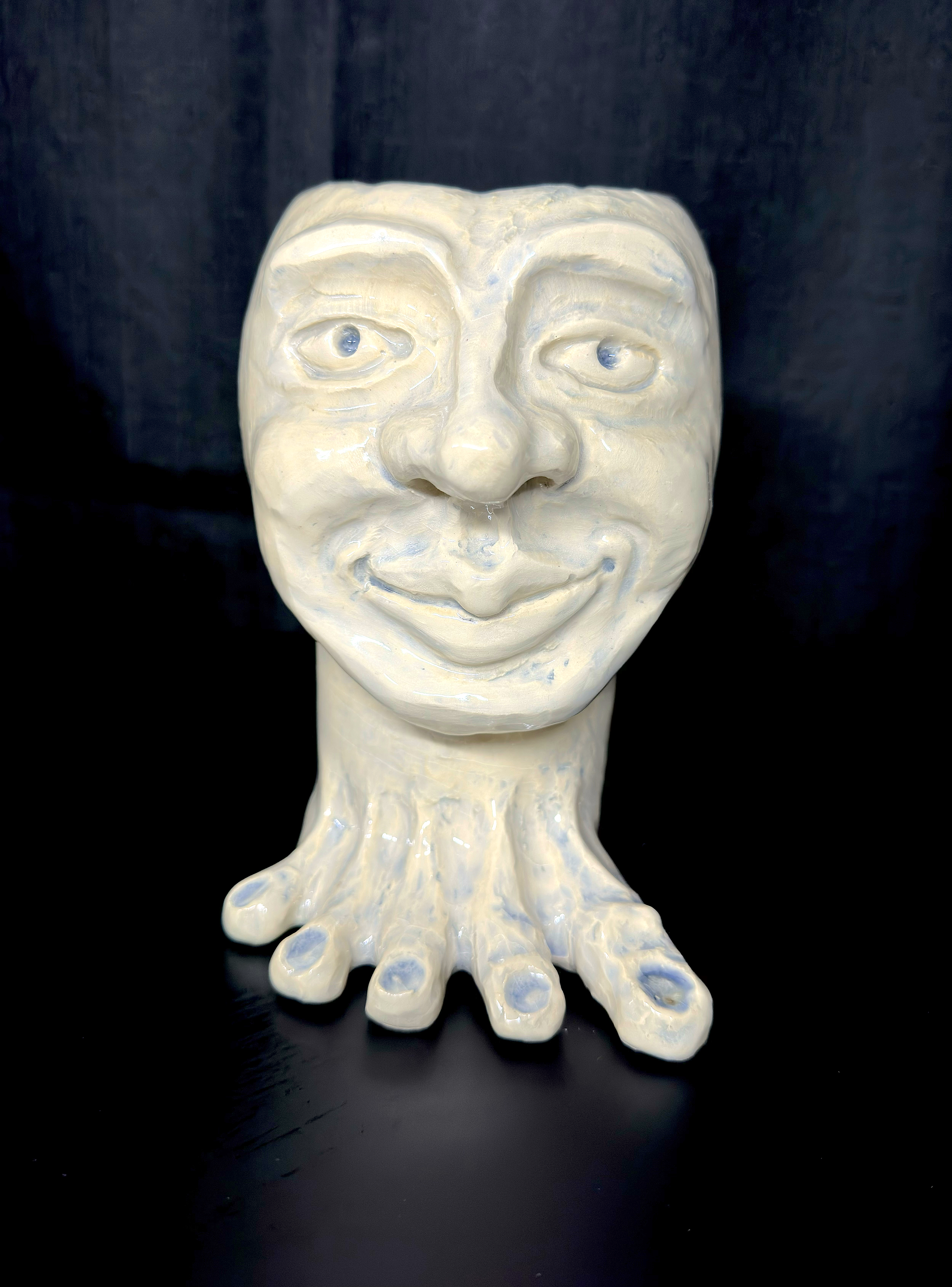John: a glazed ceramic sculpture combining a wheel-thrown base with hand-built features to create a strange, unsettling character.