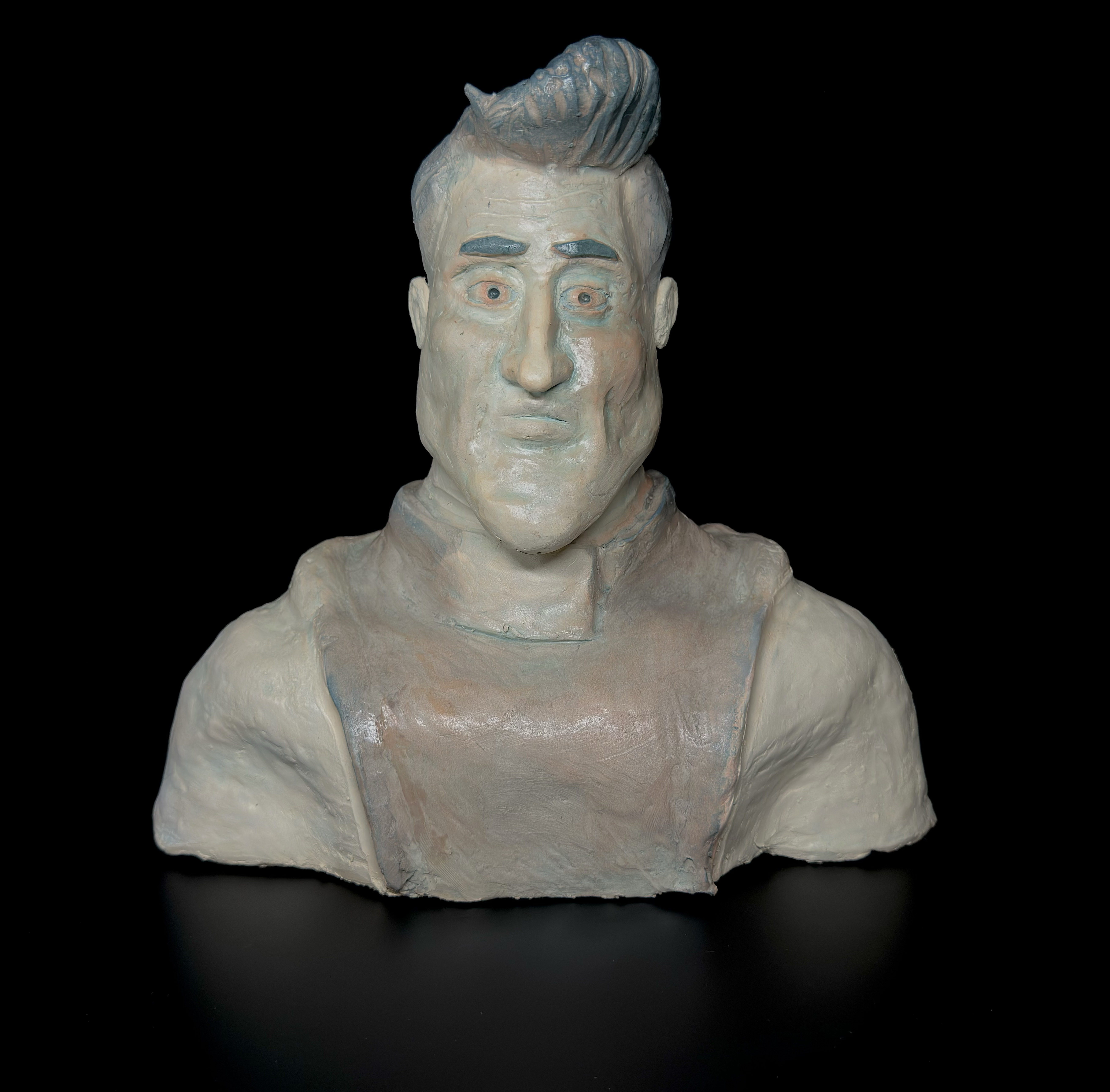 Metroman: a hand-built glazed ceramic bust translating the character’s exaggerated expression, hairstyle, and costume into sculpture.